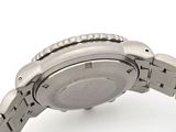 a close up of a watch on a white surface