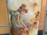 a vase with a picture of a woman on it and a vase with a picture of a woman on it