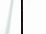 a baseball bat that is leaning up against a white wall