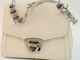 beige leather handbag with silver hardware and chain strap