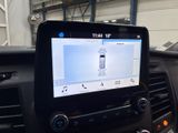 a car dashboard with a cell phone in the center