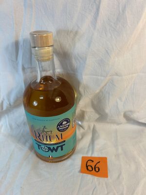 a bottle of liquor sitting on a table with a price tag on it