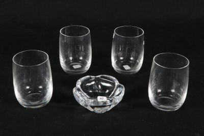 four empty glasses and a ashtray on a black background