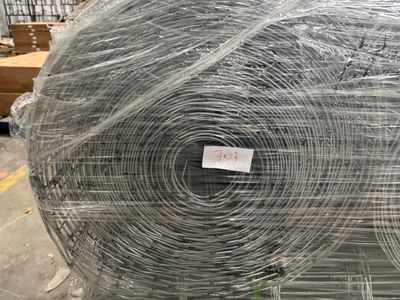 several rolls of wire wrapped in plastic sitting on top of a pallet