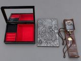 a box with a watch and other items on a table