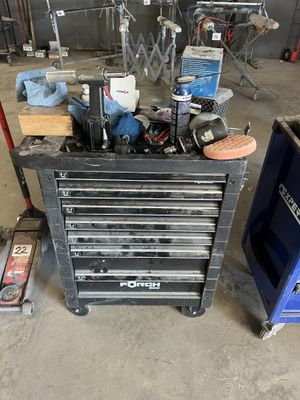 a workbench with many tools on it in a garage