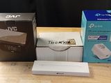 three boxes of nintendo wii games sitting on a wooden table