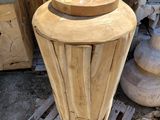 a wooden vase that is sitting on a pallet