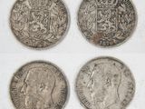 four different types of silver coins on a white surface