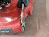 a red machine that is sitting on the floor