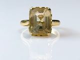 an image of a ring with a yellow topazte stone