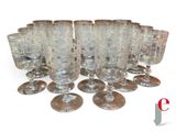 a lot of empty wine glasses sitting on a table