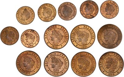 a close up of a bunch of coins on a white surface