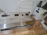 a machine that is sitting on top of a wooden table