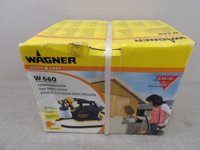 the box is open to show the contents of a power washer