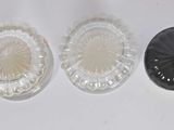 three glass plates with gold and green designs on them