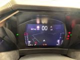 the dashboard of a car with a digital display on it