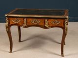a small wooden table with a marble top on it