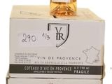 boxes stacked on top of each other with a bottle of wine on top of them