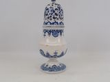 a white and blue vase with a blue and white design on it