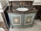 a marble sink in a bathroom with a marble counter top