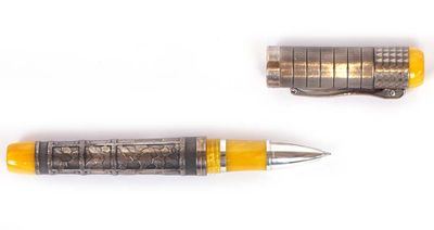 two pens sitting next to each other on a white surface