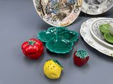 many plates and bowls that are on the table