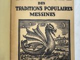 un vieux livre sur lequel figure l'image d'un dragon