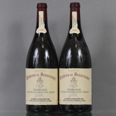two bottles of wine sit on a table with a gray background