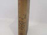 a wooden vase with birds on it on a white background