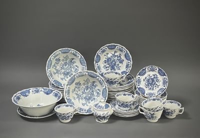 blue and white porcelain dinnerware with blue flowers on a gray background