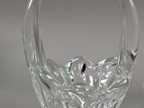 pair of clear glass vases on a table with a gray background