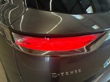 a close up of the rear end of a car in a showroom