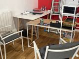 an image of a home office with a desk and chairs