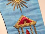 a close up of a necktie with a design on it
