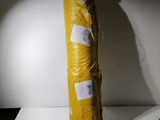 a large roll of yellow tarp sitting on a table