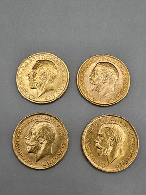 four gold coins with a portrait of a man and a woman on them