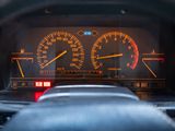 a car dashboard with a speedometer and gauges on it