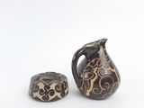 two vases that are sitting next to each other on a table