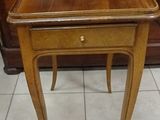 a small wooden table with a drawer underneath it
