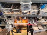 many bins of assorted items on a shelf
