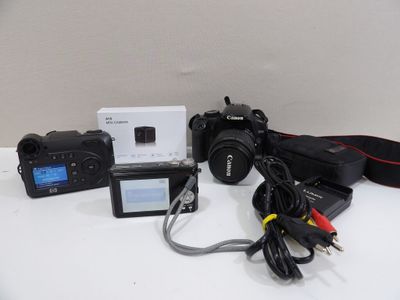 a camera and other electronics sitting on a table