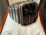 a watch sitting in a box with a price tag on it