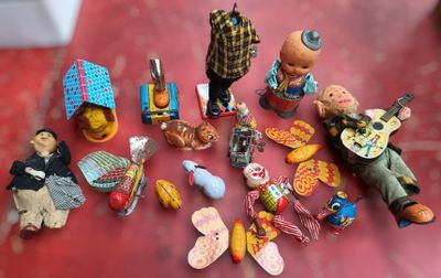 many figurines that are sitting on a red table
