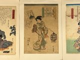 three asian women in kimono robes are standing next to each other