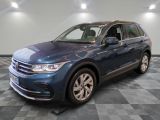 the volkswagen tiguan is parked in a large room