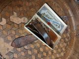 a box with a tie, wallet, and a certificate on it