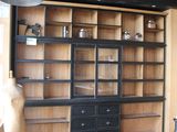a room with a large bookcase and a star hanging from the ceiling