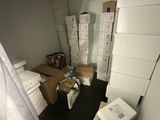 a room with a lot of boxes and boxes on the floor