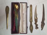 four different types of knives in a box on the floor